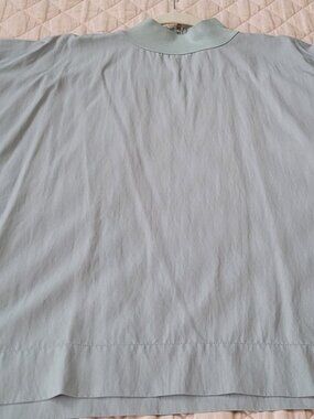 Aqua color Anthropology Flat White boxy size small top.